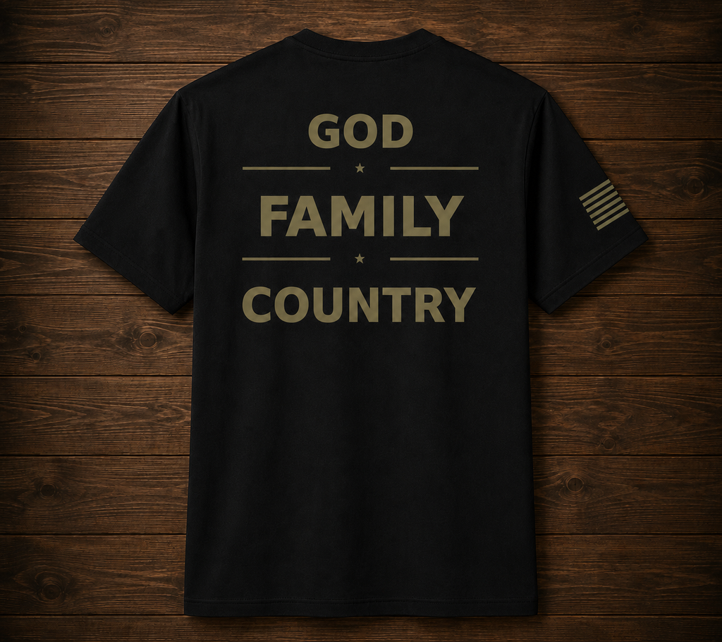 Black t-shirt with 'GOD FAMILY COUNTRY' text on a wooden surface