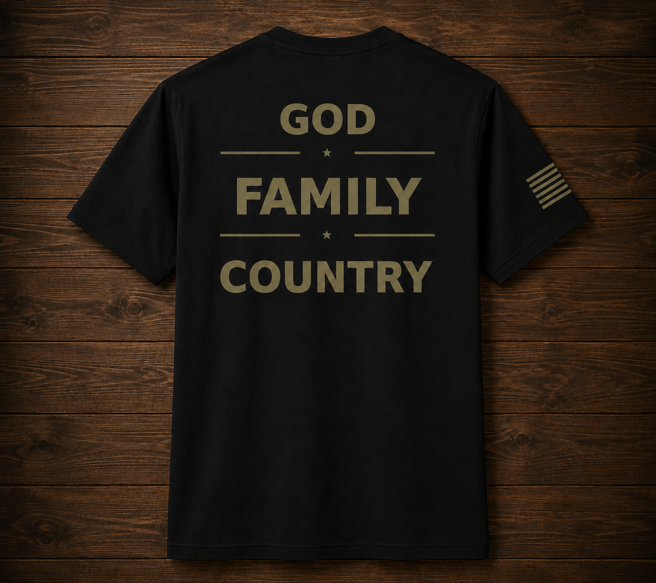 Black t-shirt with 'GOD FAMILY COUNTRY' text on a wooden surface